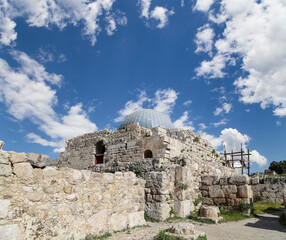 Amman city landmarks-- old roman Citadel Hill, Jordan. Against the background of a beautiful sky with clouds