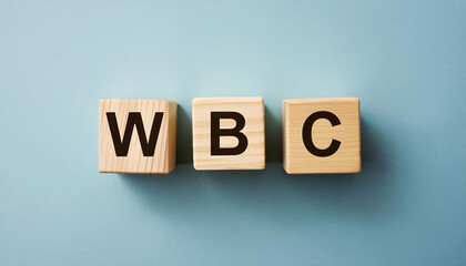 Wood cubes with abbreviation text WBC. White Blood Cells; World Boxing Council. Top view.