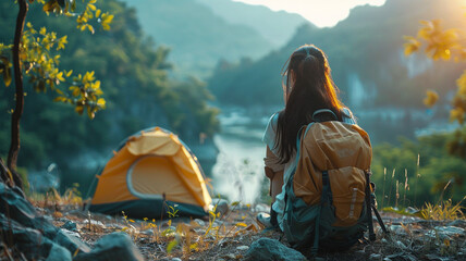 Asian woman travel and camping alone at natural park in Thailand. Recreation and journey outdoor activity lifestyle. Good morning and fresh start of the day. 