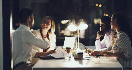 Business people, handshake and night in office for well done for deadline of project, b2b and agreement for task. Corporate, employees and shaking hands in dark for overtime, proposal and partnership