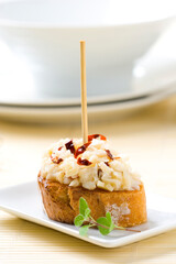 Spanish tapas food. Cod and chilli skewer. Vertical photo..