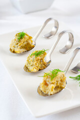 Omelette with artichokes and onions, served as tapas in spoons..