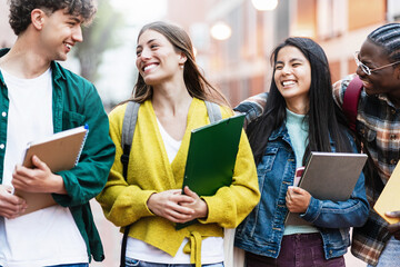 Cheerful students having fun together laughing after university lectures