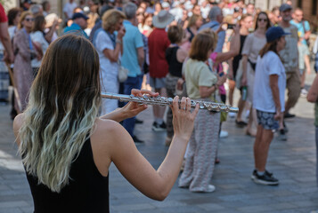 Street performer with transverse flute © Michal