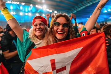 Joyful sports fans with a Swiss flag loudly supporting their team at a vibrant event