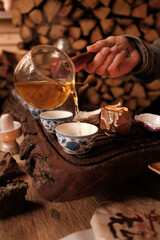 Host pouring tea to a guest on a tea ceremony