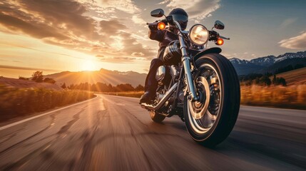 A motorcyclist rides on a scenic highway at sunset, capturing the spirit of adventure and freedom on the open road.
