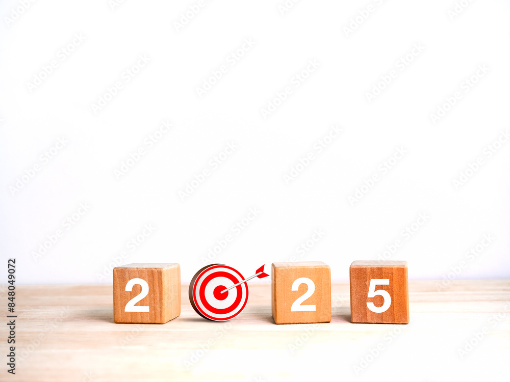Poster 2025 happy new year background banner. numbers on wooden cube blocks with 3d target dart icon on woo