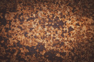 A rusty surface with many holes and spots