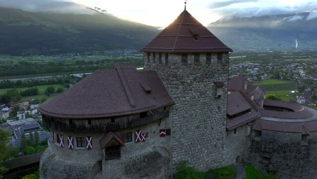 Vaduz Castle in Liechtenstein. Picturesque view of fairytale castle in Alps mountains at Sunset Time. A Landmark Aerial