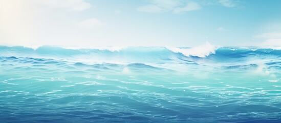 The smooth natural blue water background with bokeh abstract on the sea or ocean vintage and soft colored blur. Creative banner. Copyspace image