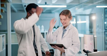 Scientists, tablet and research with high five in lab for success with celebration in medical field. Teamwork, technology and breakthrough with cutting edge analysis, science target for future.