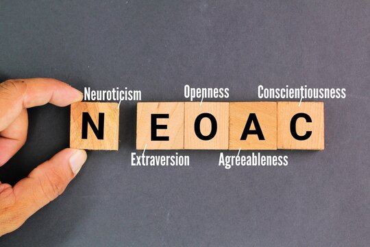 wooden square with the letters NEOAC or the words neuroticism, extraversion, openness, agreeableness and conscientiousness. the big 5 leadership