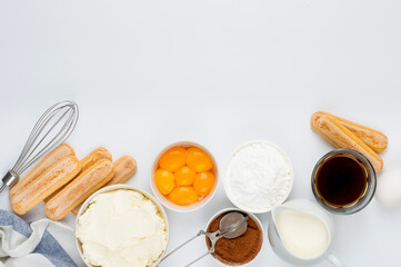 Ingredients for preparing the Italian dessert tiramisu. Savoiardi cookies, mascarpone, yolks,...