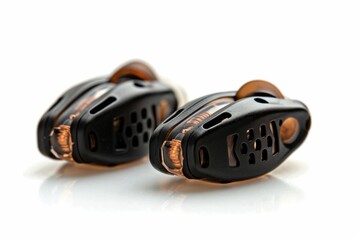 Fototapeta premium Compact Black Earbuds with Orange Accents