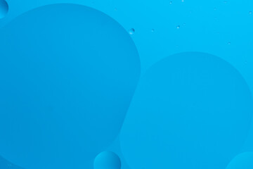 Abstract image with blue bubbles light blue gradient background with smooth lines.