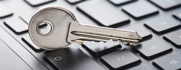 phishing, hacking personal data and money , key and hook on computer keyboard.