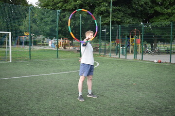 A young man in sportswear engages in a workout, using a sport tool for physical exercises on a...