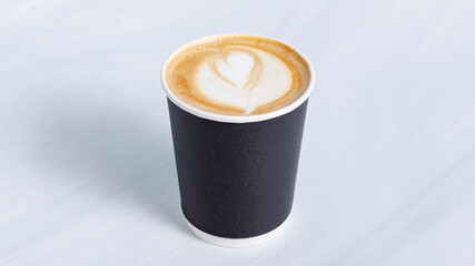 Cappuccino coffee in paper cup isolated