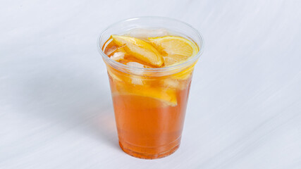 Peach lemonade glass with ice isolated