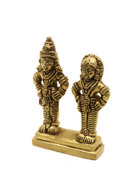 antique statue of god and goddess couple handcrafted in gold, deities of myth from hindu religion of worship isolated in a white background