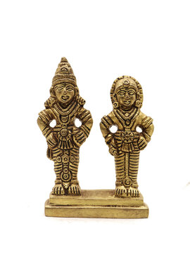 antique statue of god and goddess couple handcrafted in gold, deities of myth from hindu religion of worship isolated in a white background
