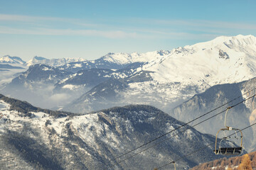 French Alps forested mountain slope with ski lift