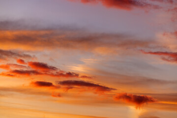 Dramatic sky with orange and dark clouds