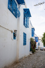 Fototapeta premium White-blue city of Sidi Bou Said, Tunisia. Eastern fairy tale with a French charm. View of an old historic building, Sidi Bou Said Carthage, Tunisia.