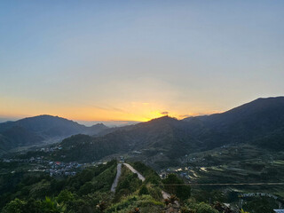 Beautiful Sunset with the view of the mountain. Sun setting behind the mountains