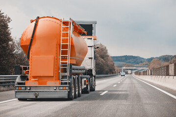 Petrol truck on highway hauling fossil oil refinery products. Fuel delivery transportation....