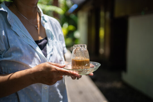 Kopi Khop, serving coffee by turning the glass upside down. Typically carried out in Aceh, Indonesia.