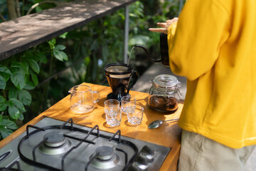 The process of brewing black coffee in a calm and relaxing atmosphere