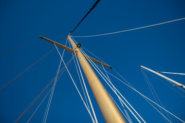 Wind indicator mounted on top of a sailboat mast. Wind direction and speed on a sailboat and blue...