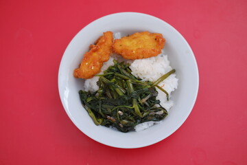 Nutritious plate of food featuring rice and assorted vegetables, a balanced and delicious dish
