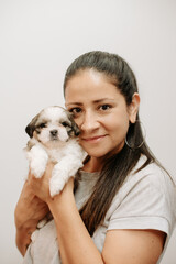 Happy young woman with small dog