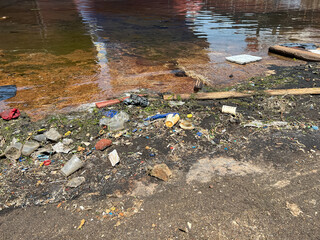 garbage, plastic in the water in dry dock, port. Marine pollution from shipping and shipbuilding, Marpol