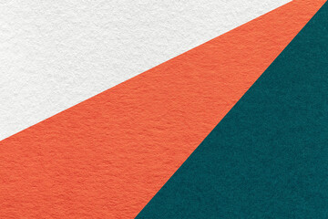 Fototapeta premium Texture of old craft white, orange and emerald color paper background, macro. Vintage abstract cardboard