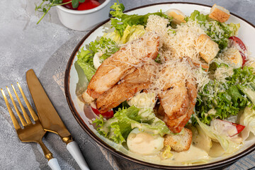 Salad bowl with chicken breast, rice, tomatoes, cucumbers and avocado Boiled egg