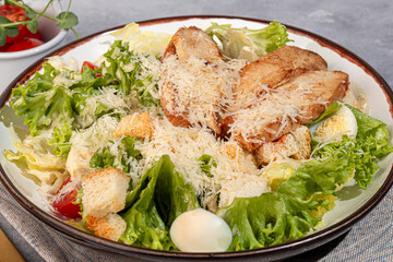 Salad bowl with chicken breast, rice, tomatoes, cucumbers and avocado Boiled egg