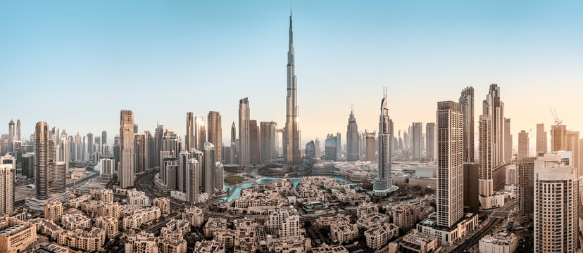 the city center of dubai during sunrise