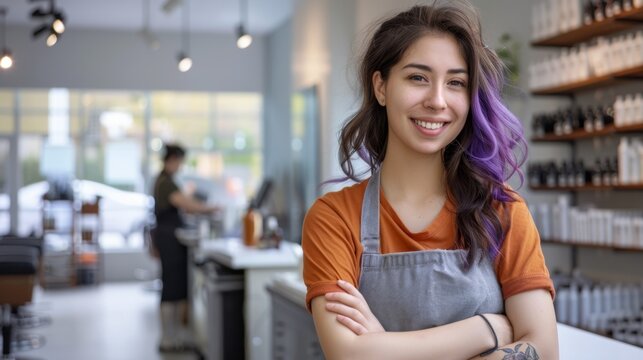 The smiling female hairstylist