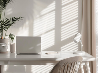 Fototapeta premium Comfortable workspace featuring a sleek laptop on a white wooden desk