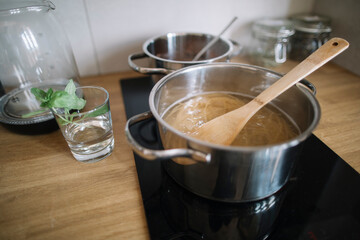 Cooking raw spaghetti in the boiling water on electric ceramic hob