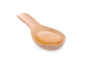 honey in spoon on white background