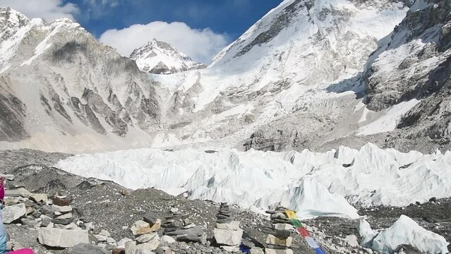 Close up caucasian woman trekker reaching Everest base camp enjoy viewpoint on Khumbu icefall in Himalayas mountains.Sagarmatha national park. Nepal travel destination concept