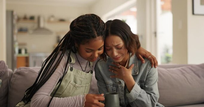 Crying woman, hug and friends on sofa with conversation, support and solution, problem solving and trust at home. Comfort, understanding or women in a living room with bad news, empathy or advice