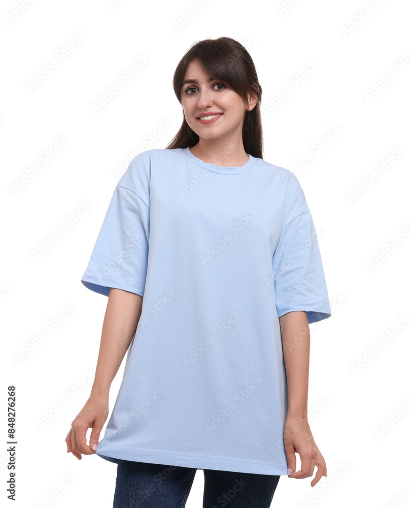Wall mural smiling woman in stylish light blue t-shirt on white background - Wall murals