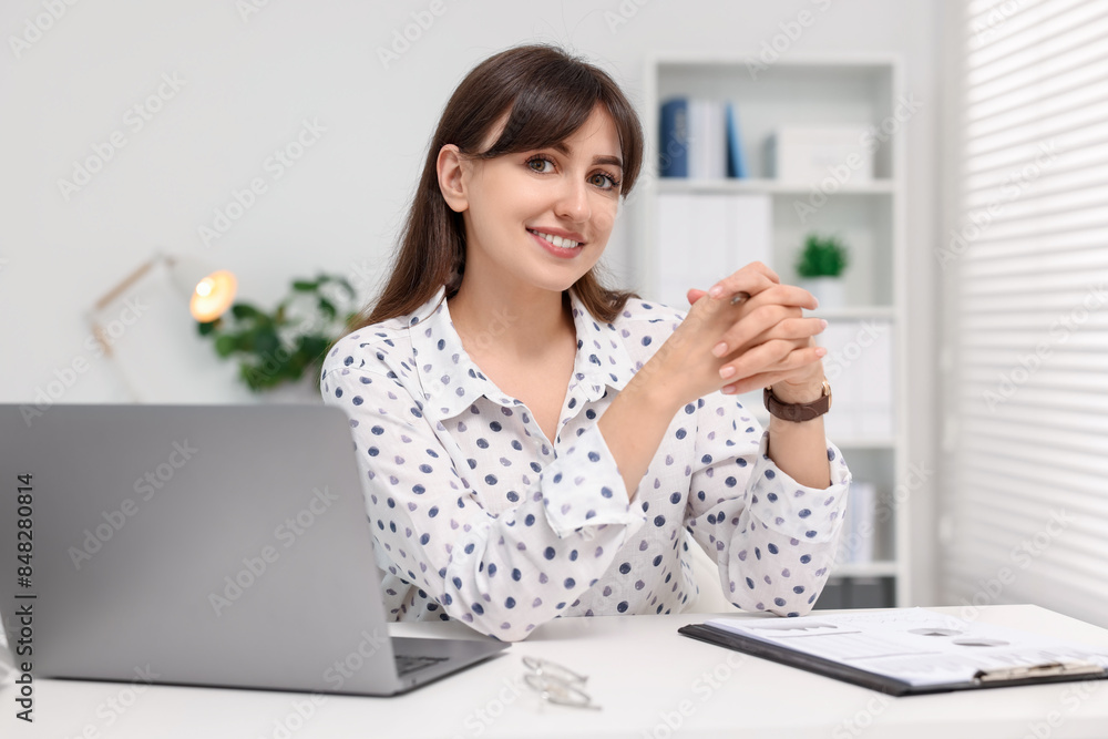 Canvas Prints portrait of smiling secretary at table in office