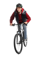 Fototapeta premium Smiling man in helmet riding bicycle on white background